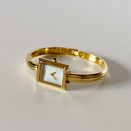 Yves Saint Laurent 1990s Seashell Dial Gold Plated Bangle Watch (8/22)
