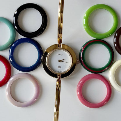 Gucci 1990s Interchangeable Bezel Gold Plated Bangle Watch with 12 bezels, case