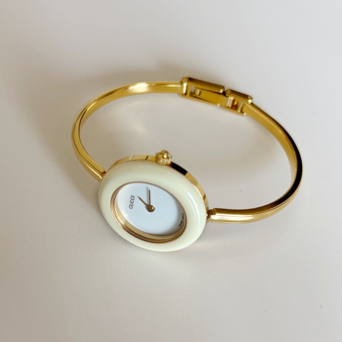 Gucci 1990s Interchangeable Bezel Gold Plated Bangle Watch with 12 bezels, case