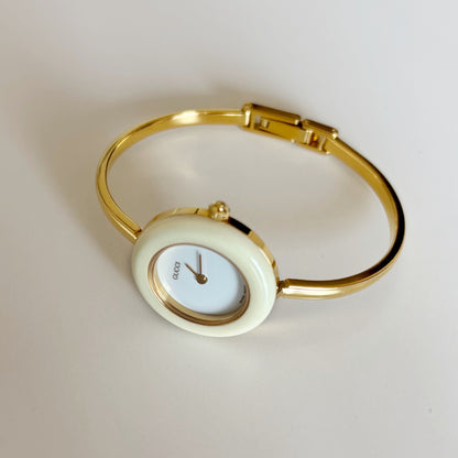 Gucci 1990s Interchangeable Bezel Gold Plated Bangle Watch with 12 bezels, case