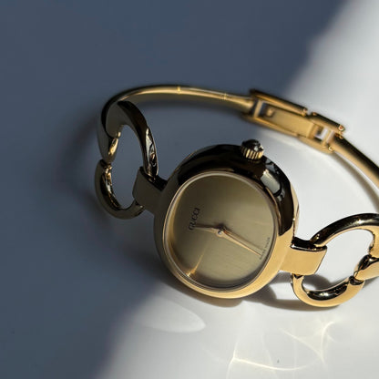 Gucci 1990s Oval Dial Gold Plated Bangle Watch