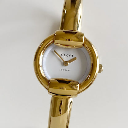 Gucci 1990s Round Dial Gold Plated Bangle Watch