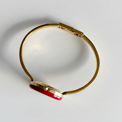 Gucci 1990s Interchangeable Bezel Gold Plated Bangle Watch with 12 bezels, case