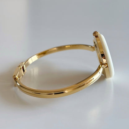 Gucci 1990s Interchangeable Bezel Gold Plated Bangle Watch with 12 bezels, case