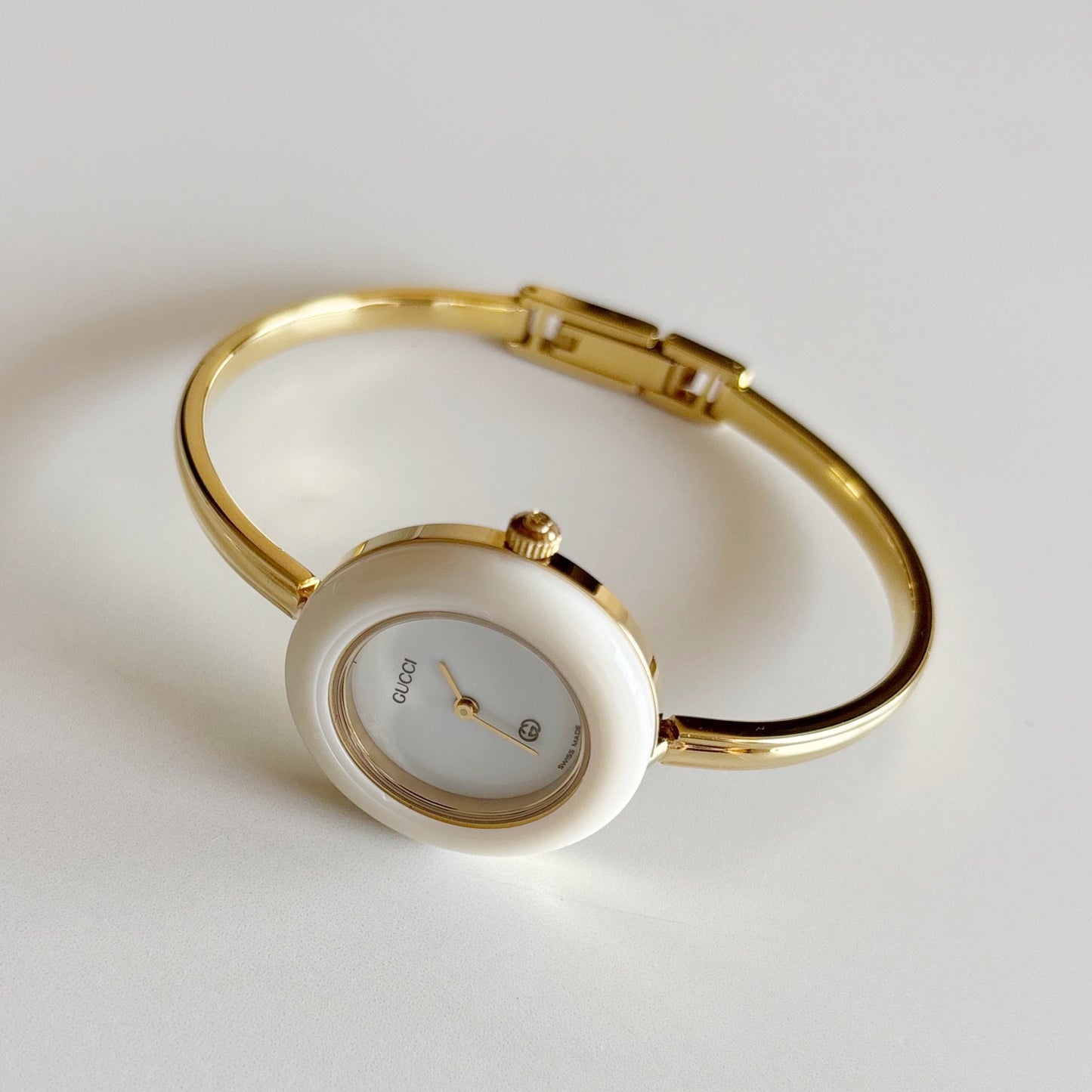 Gucci 1990s Interchangeable Bezel Gold Plated Bangle Watch with 12 bezels, case