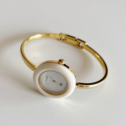 Gucci 1990s Interchangeable Bezel Gold Plated Bangle Watch with 12 bezels, case