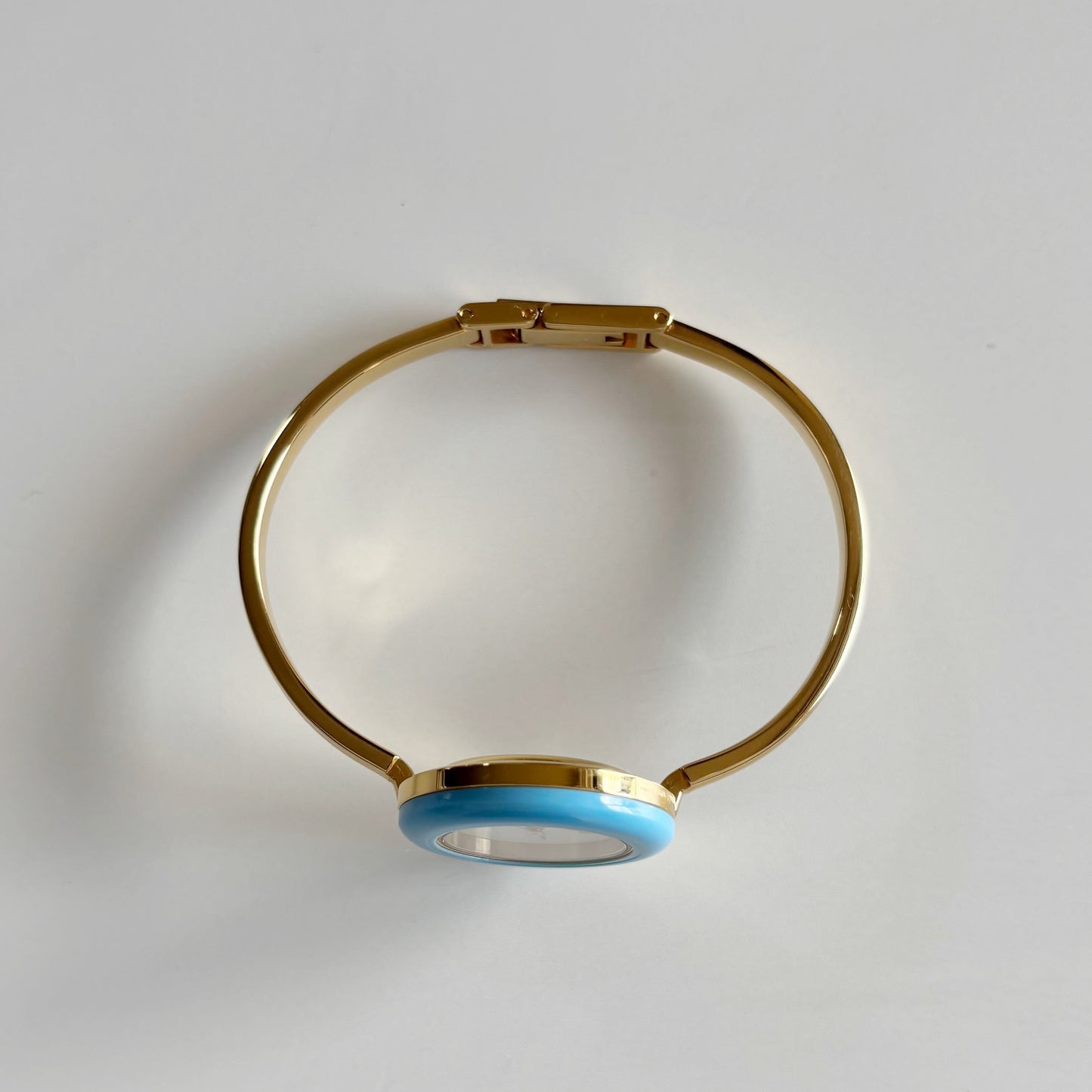 Gucci 1990s Interchangeable Bezel Gold Plated Bangle Watch with 12 bezels, case