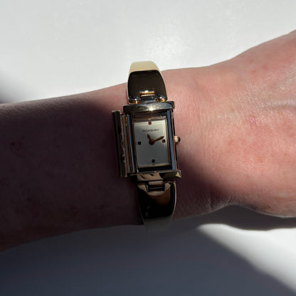 Yves Saint Laurent 1990s Peek-A-Boo Gold Plated Bangle Watch