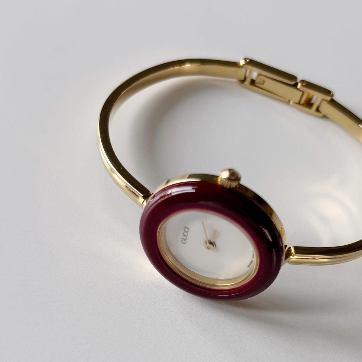 Gucci 1990s Interchangeable Bezel Gold Plated Bangle Watch with 12 bezels, case