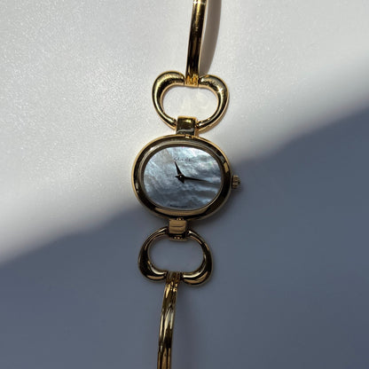 Gucci 1990s Seashell Oval Dial Gold Plated Bangle Watch (Small)