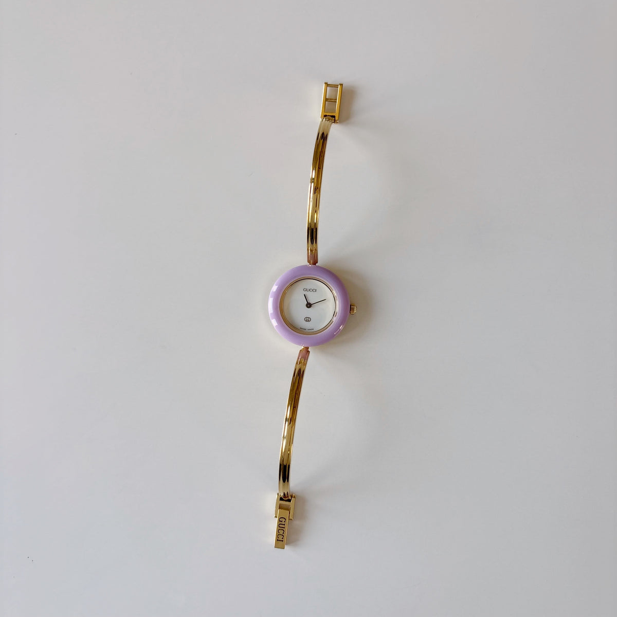 Gucci 1990s Interchangeable Bezel Gold Plated Bangle Watch with 12 bezels, case