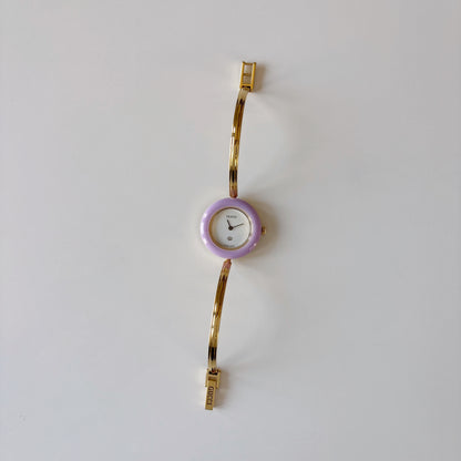 Gucci 1990s Interchangeable Bezel Gold Plated Bangle Watch with 12 bezels, case