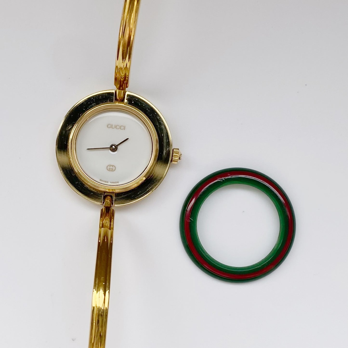 Gucci 1990s Interchangeable Bezel Gold Plated Bangle Watch with 12 bezels, case