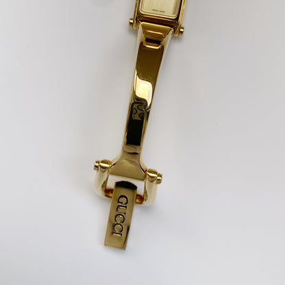 Gucci 1990s Rectangular Gold Dial Gold Plated Bangle Watch (Small)