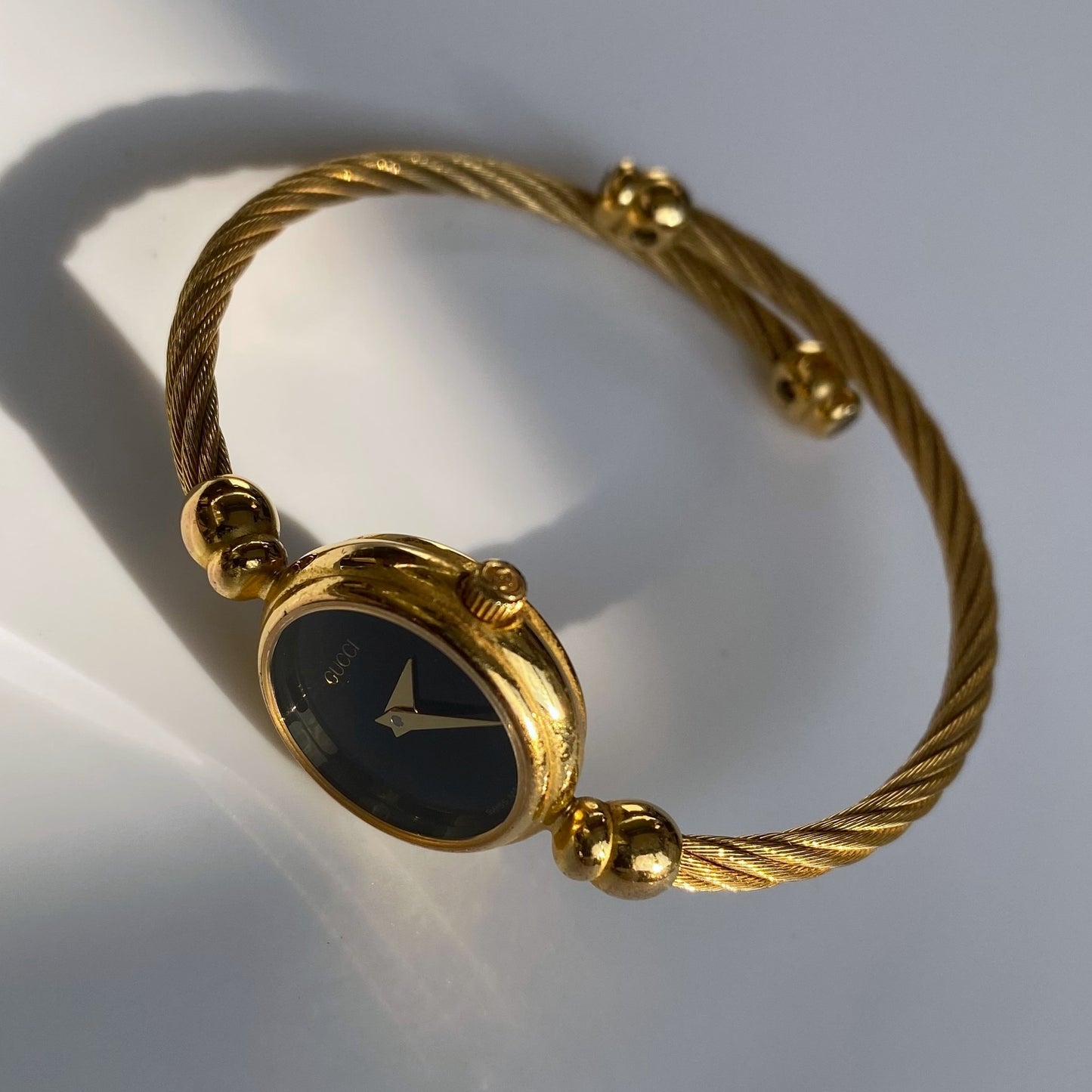 Gucci 1990s Black Dial Gold Plated Bangle Watch