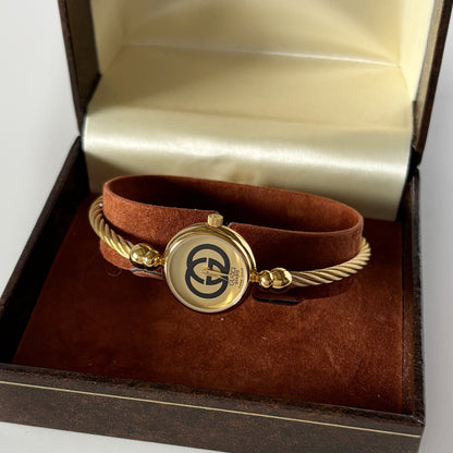 Gucci 1980s Round Dial Cable Band Bangle Watch