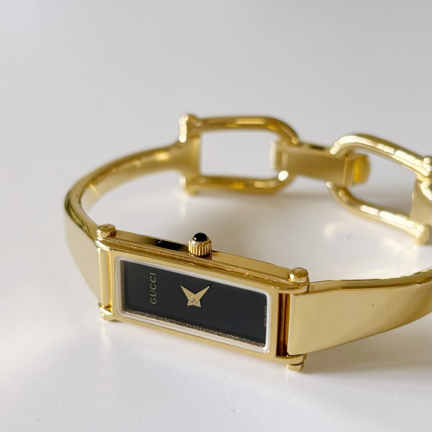 Gucci 1990s Black Dial Rectangular Gold Plated Bangle Watch