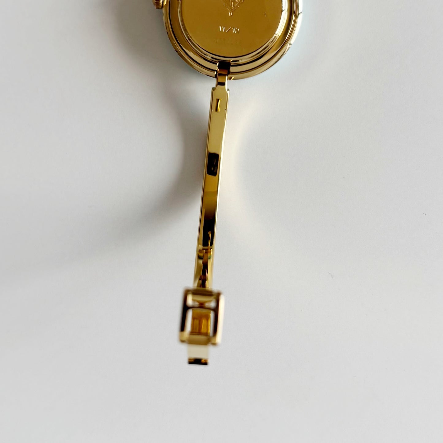 Gucci 1990s Interchangeable Bezel Gold Plated Bangle Watch with 12 bezels, case