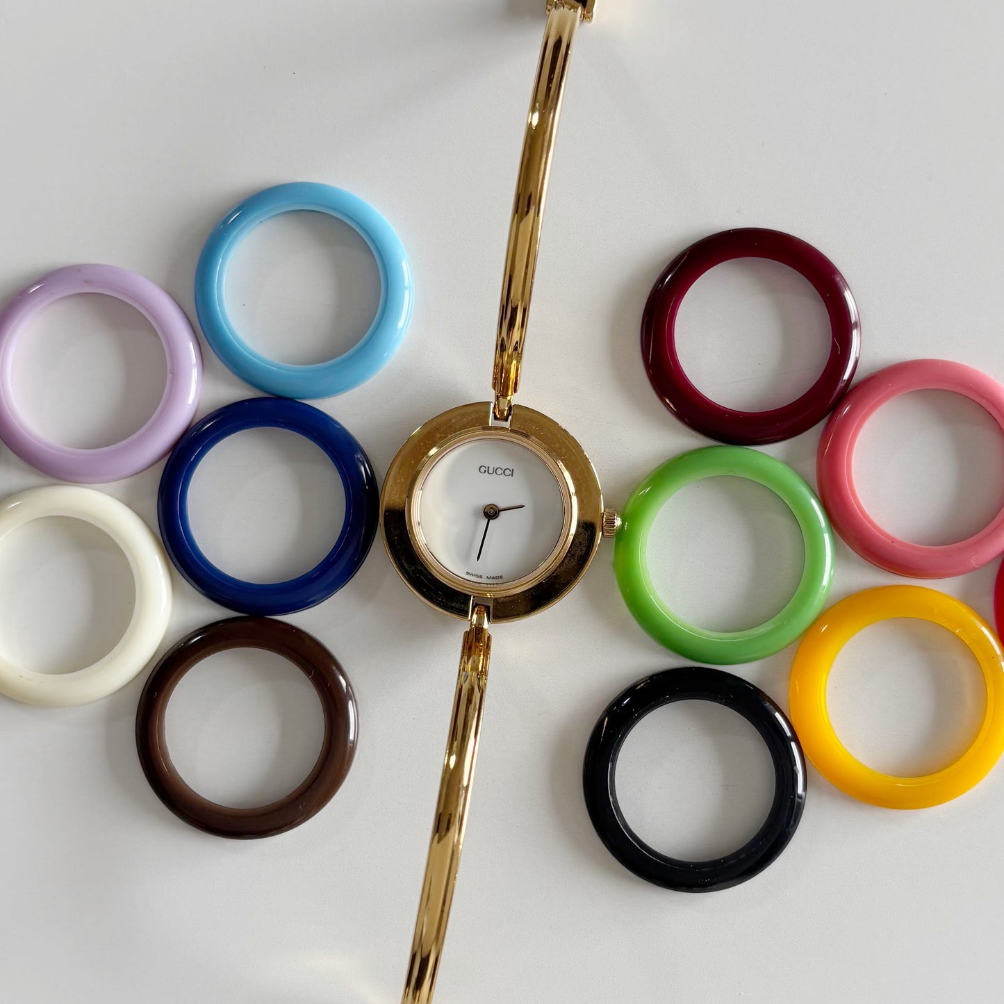 Gucci 1990s Interchangeable Bezel Gold Plated Bangle Watch with 12 bezels, case