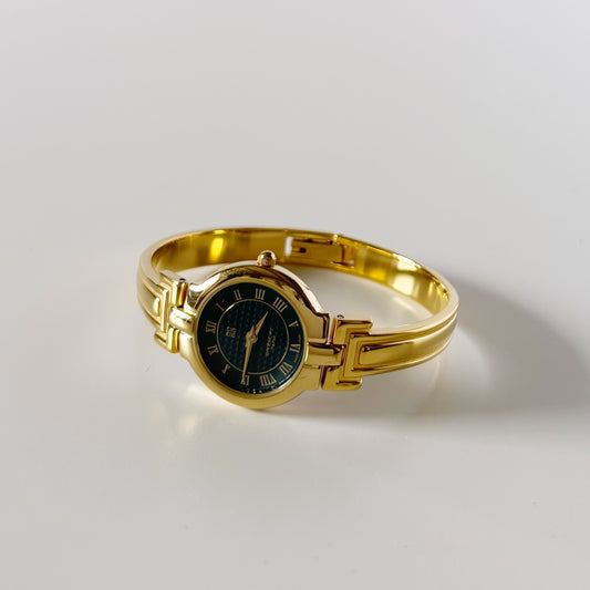 Givenchy 1990s Round Dial Gold Plated Bangle Watch