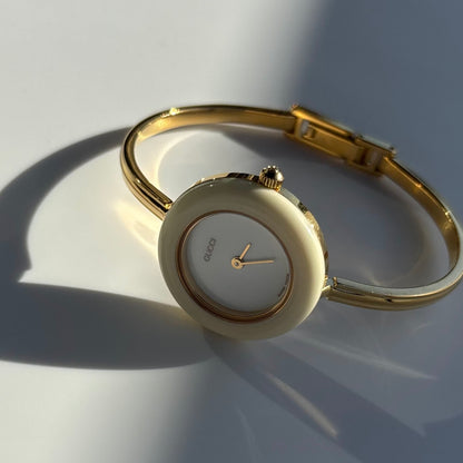 Gucci 1990s Interchangeable Bezel Gold Plated Bangle Watch with 12 bezels, case