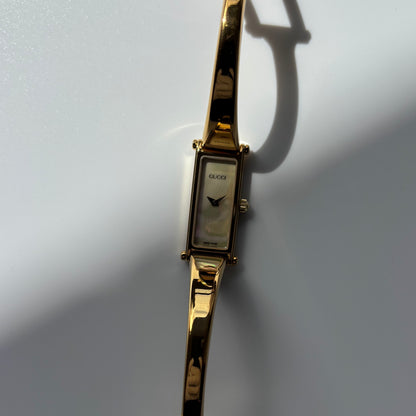 Gucci 1990s Seashell Rectangular Dial Gold Plated Bangle Watch