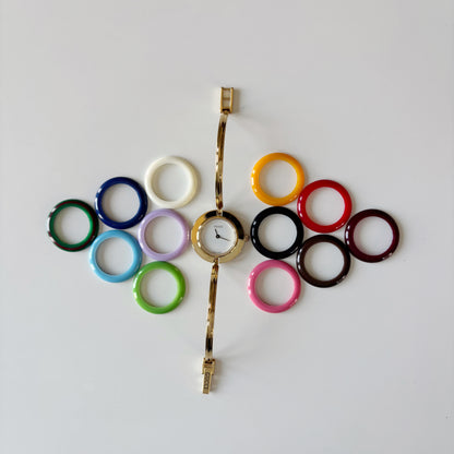 Gucci 1990s Interchangeable Bezel Gold Plated Bangle Watch with 12 bezels, case