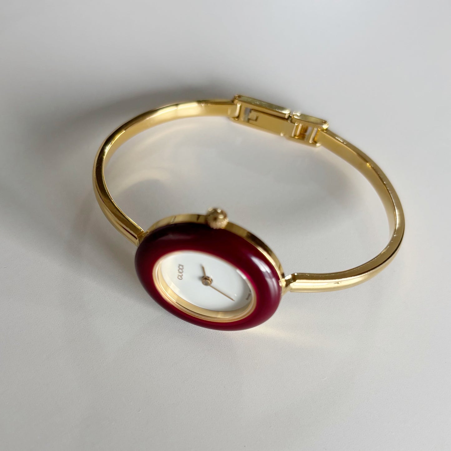 Gucci 1990s Interchangeable Bezel Gold Plated Bangle Watch with 12 bezels, case