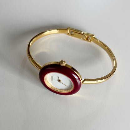 Gucci 1990s Interchangeable Bezel Gold Plated Bangle Watch with 12 bezels, case