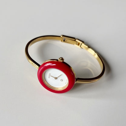 Gucci 1990s Interchangeable Bezel Gold Plated Bangle Watch with 12 bezels, case