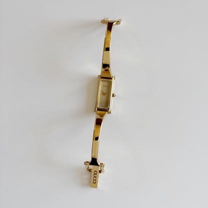 Gucci 1990s Rectangular Dial Gold Plated Bangle Watch