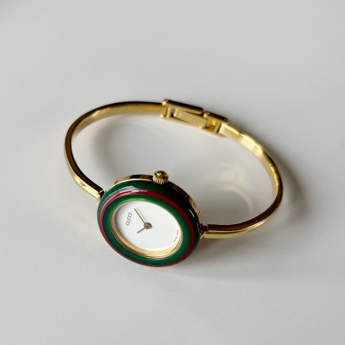 Gucci 1990s Interchangeable Bezel Gold Plated Bangle Watch with 12 bezels, case