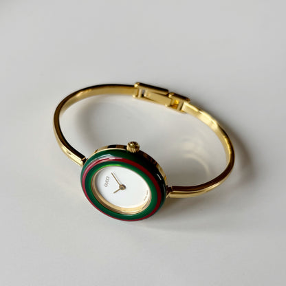 Gucci 1990s Interchangeable Bezel Gold Plated Bangle Watch with 12 bezels, case