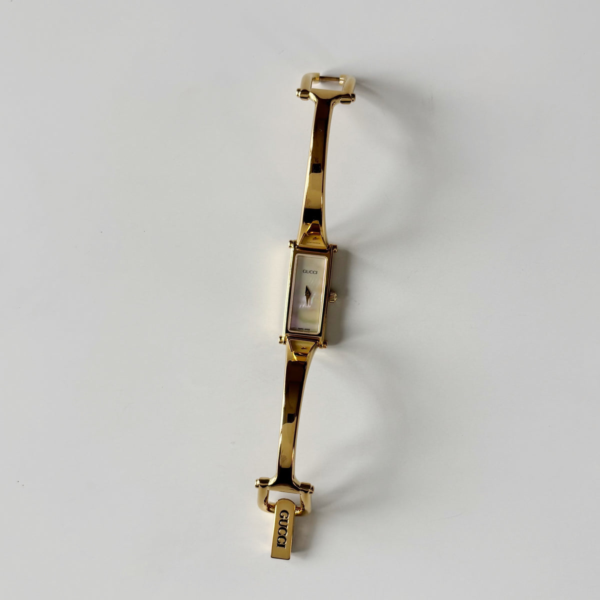 Gucci 1990s Seashell Rectangular Dial Gold Plated Bangle Watch