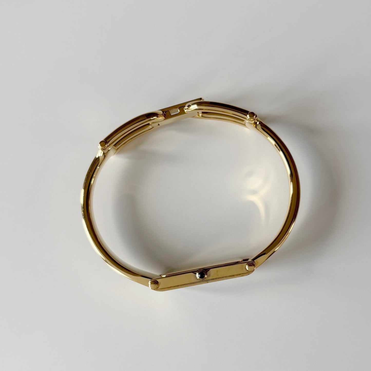 Gucci 1990s Black Rectangular Dial Gold Plated Bangle Watch