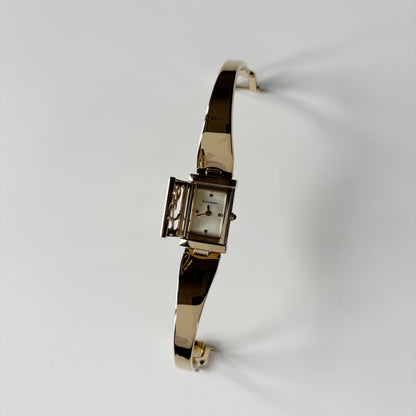 Yves Saint Laurent 1990s Peek-A-Boo Gold Plated Bangle Watch