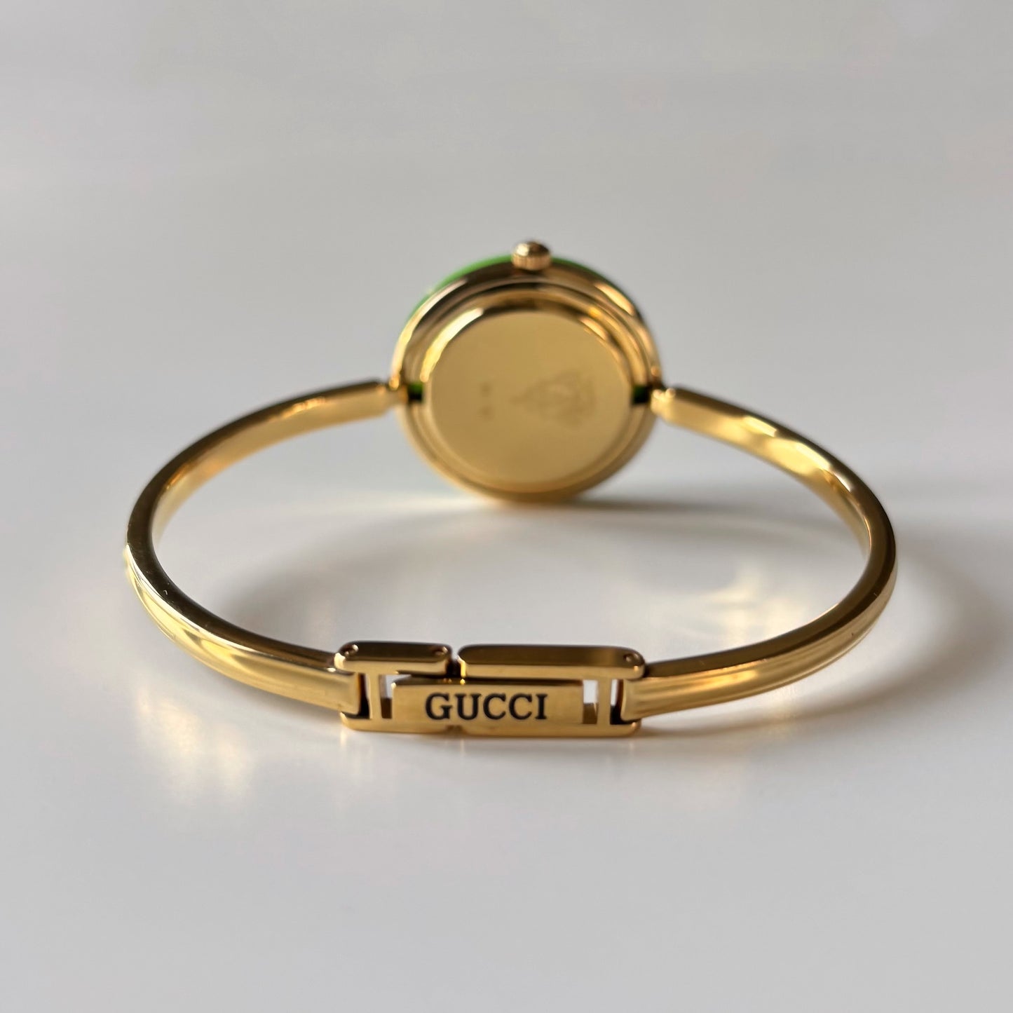 Gucci 1990s Interchangeable Bezel Gold Plated Bangle Watch with 12 bezels, case