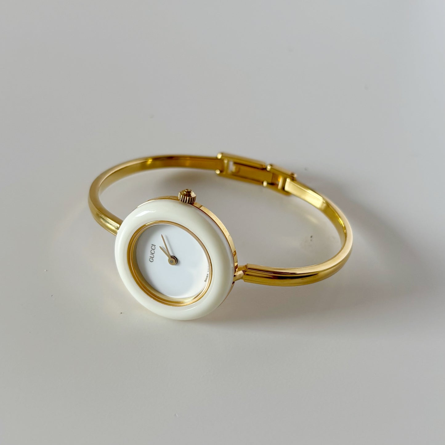 Gucci 1990s Interchangeable Bezel Gold Plated Bangle Watch with 12 bezels, case