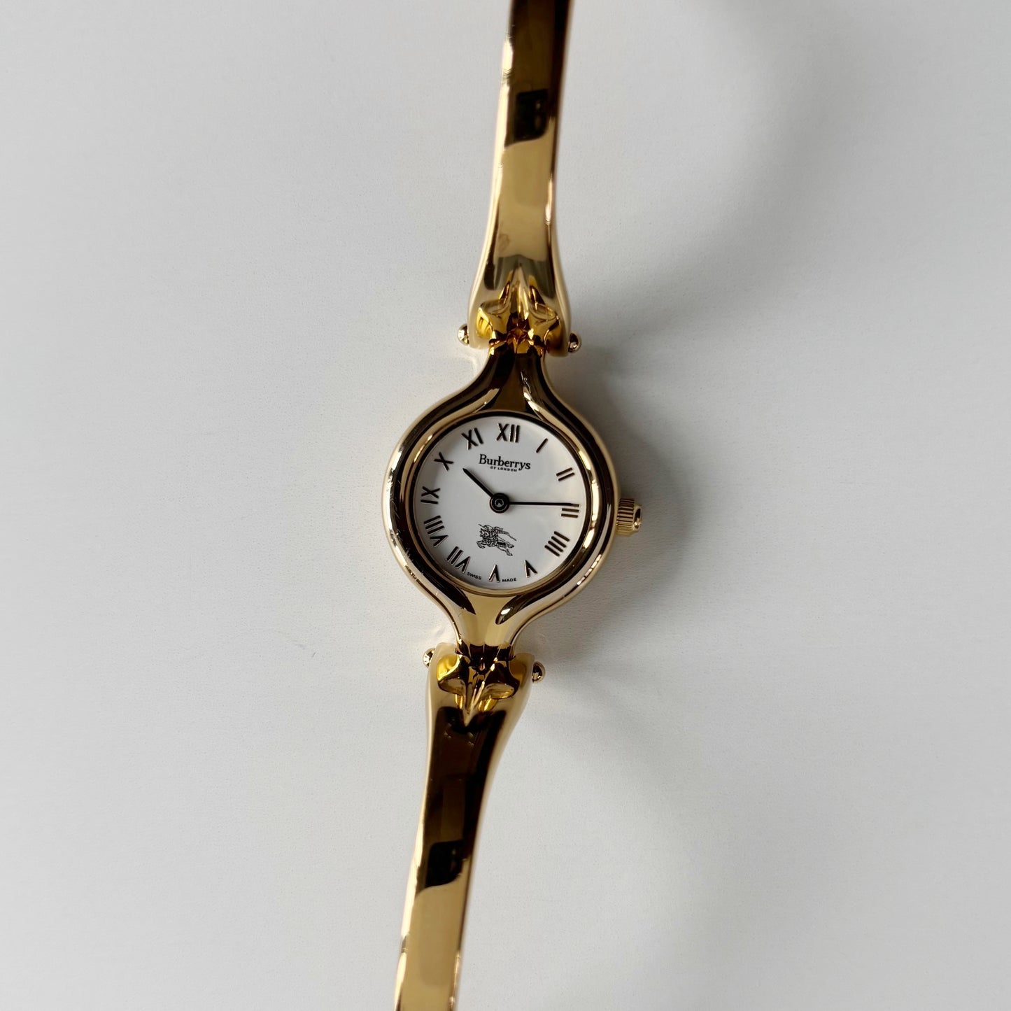 Burberry 1990s Round Dial Gold Plated Bangle Watch
