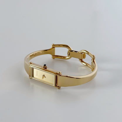 Gucci 1990s Rectangular Dial Gold Plated Bangle Watch