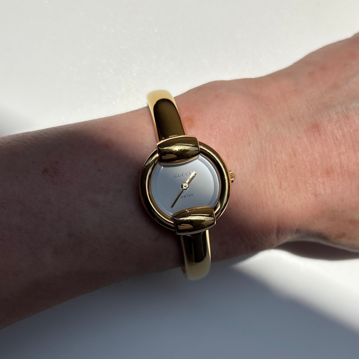 Gucci 1990s Round Dial Gold Plated Bangle Watch