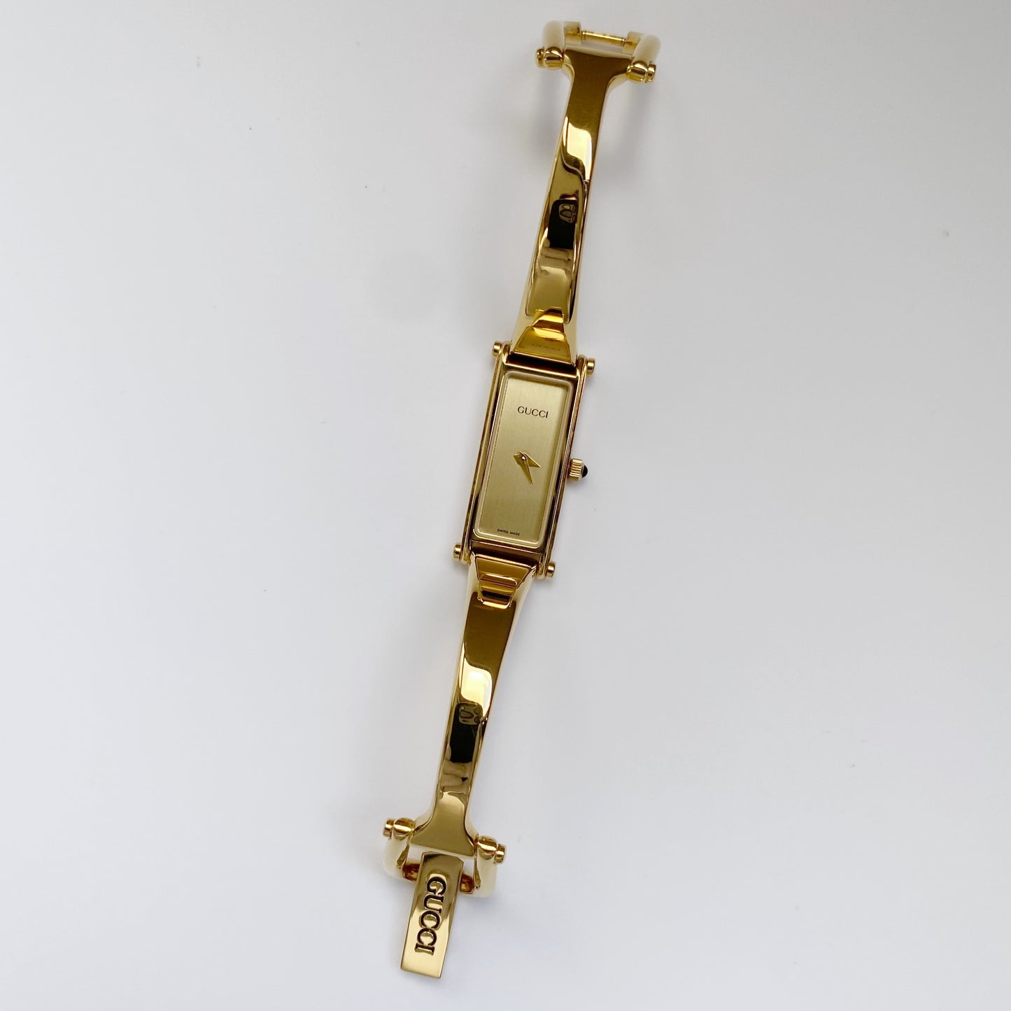 Gucci 1990s Rectangular Gold Dial Gold Plated Bangle Watch (Small)