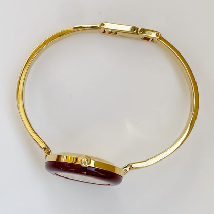 Gucci 1990s Interchangeable Bezel Gold Plated Bangle Watch with 12 bezels, case