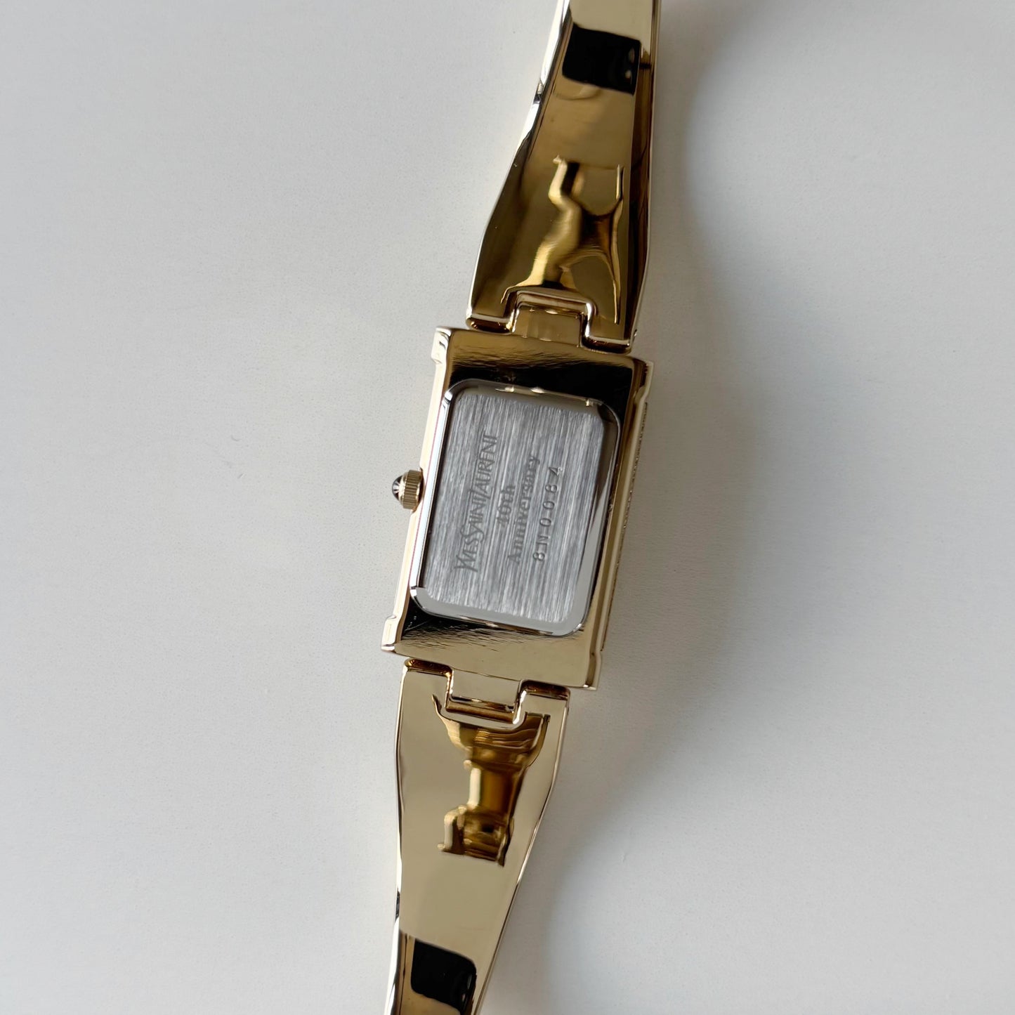 Yves Saint Laurent 1990s Peek-A-Boo Gold Plated Bangle Watch