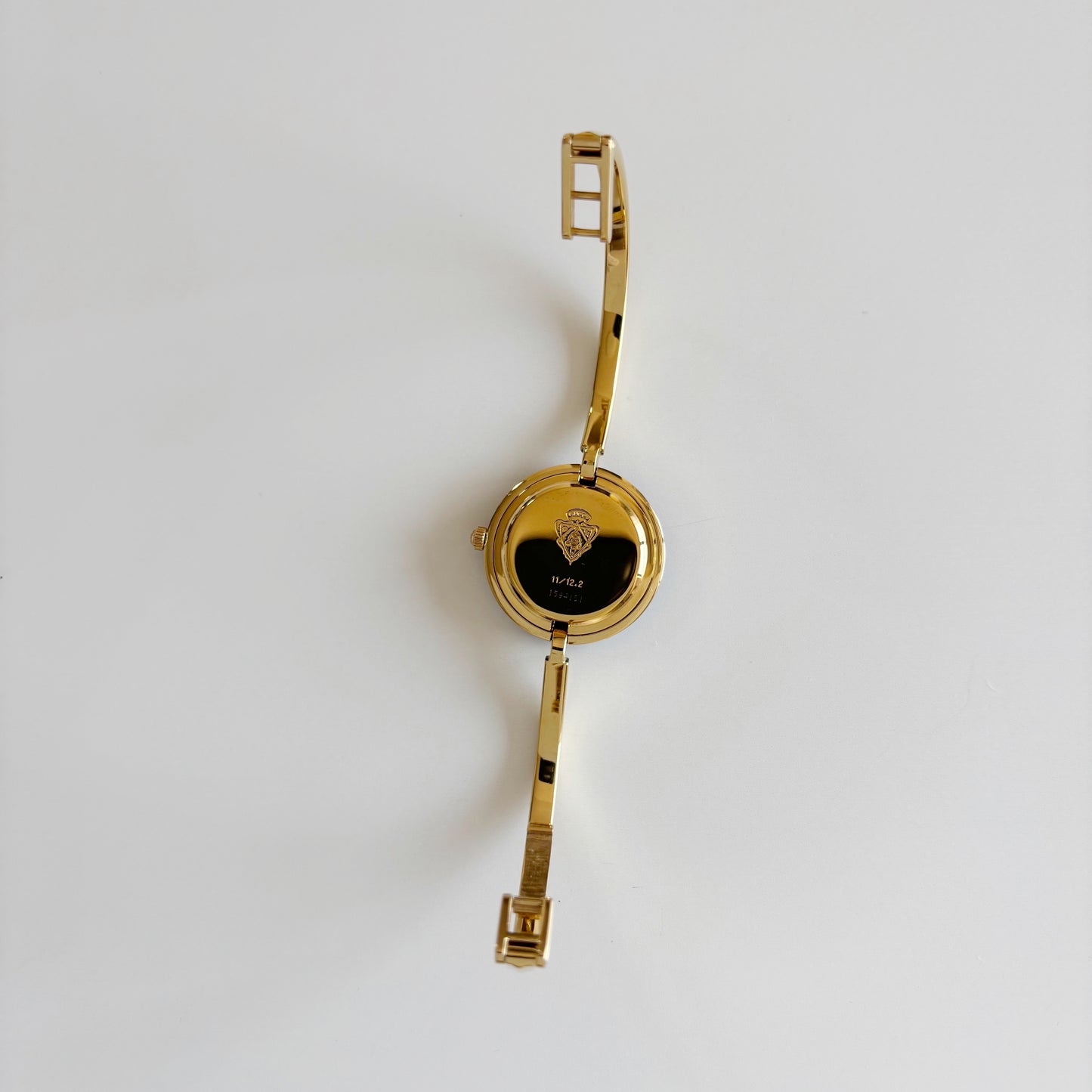 Gucci 1990s Interchangeable Bezel Gold Plated Bangle Watch with 12 bezels, case