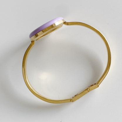 Gucci 1990s Interchangeable Bezel Gold Plated Bangle Watch with 12 bezels, case