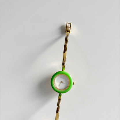 Gucci 1990s Interchangeable Bezel Gold Plated Bangle Watch with 12 bezels, case