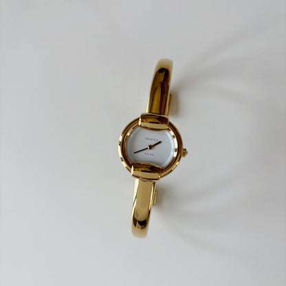 Gucci 1990s Round Dial Gold Plated Bangle Watch