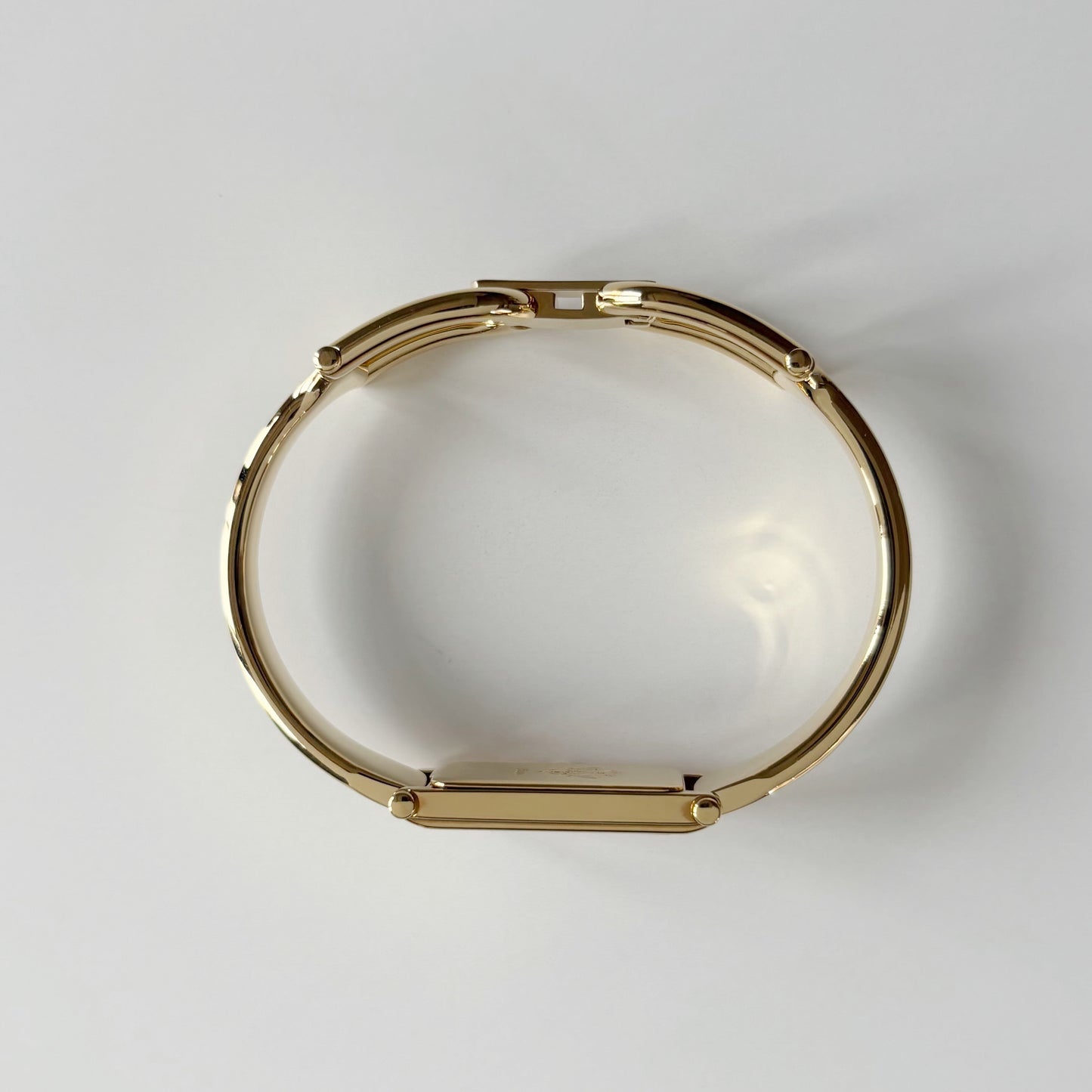 Gucci 1990s Gold Rectangular Dial Gold Plated Bangle Watch