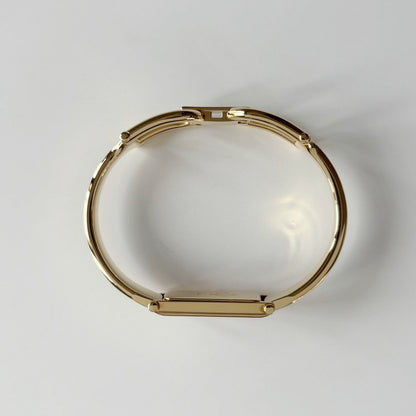Gucci 1990s Gold Rectangular Dial Gold Plated Bangle Watch